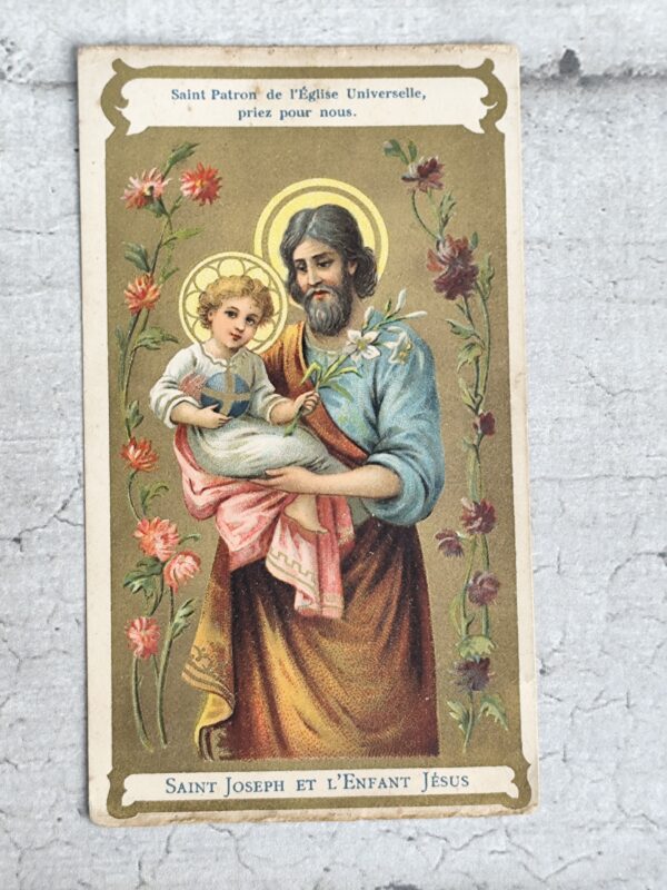 Ancienne carte religieuse du saint patron de l'église universelle saint Joseph et l'enfant Jésus.