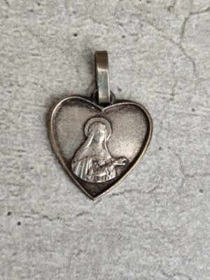 Antique médaille religieuse de sainte Thérèse de Lisieux.