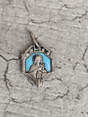 Antique médaille religieuse de sainte Thérèse en email.